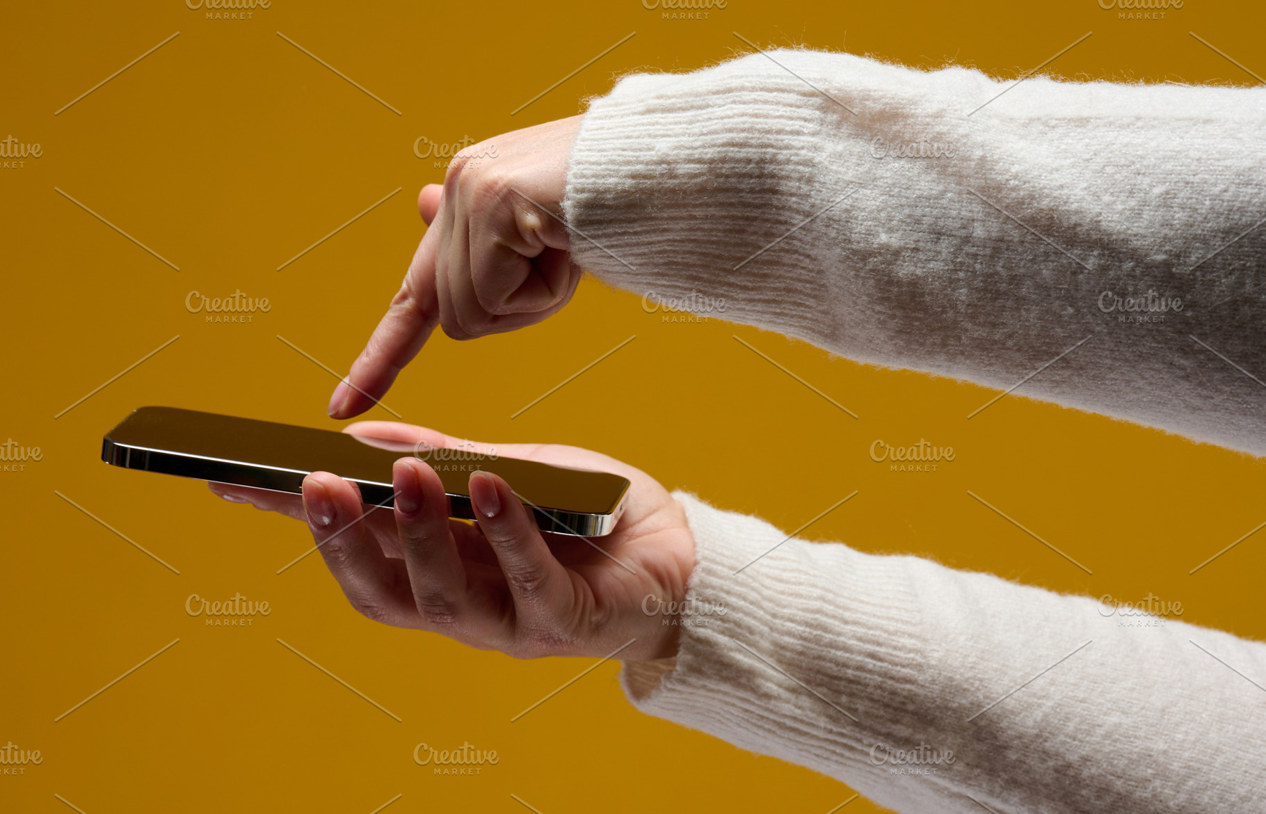 Woman using a smartphone against a yellow background, a Technology Photo by ndanko