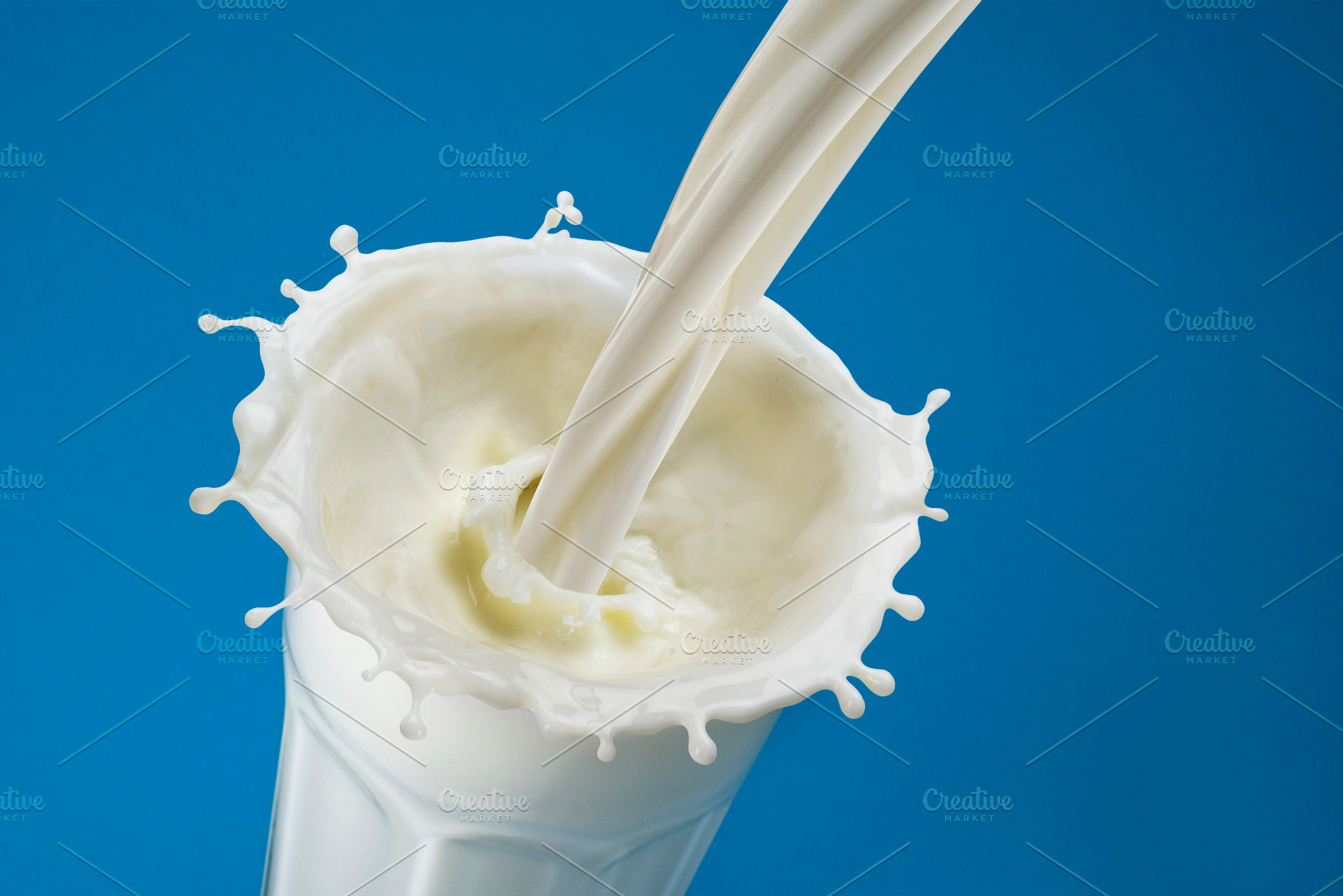 Pouring milk splash in glass, a Food & Drink Photo by Max Lashcheuski