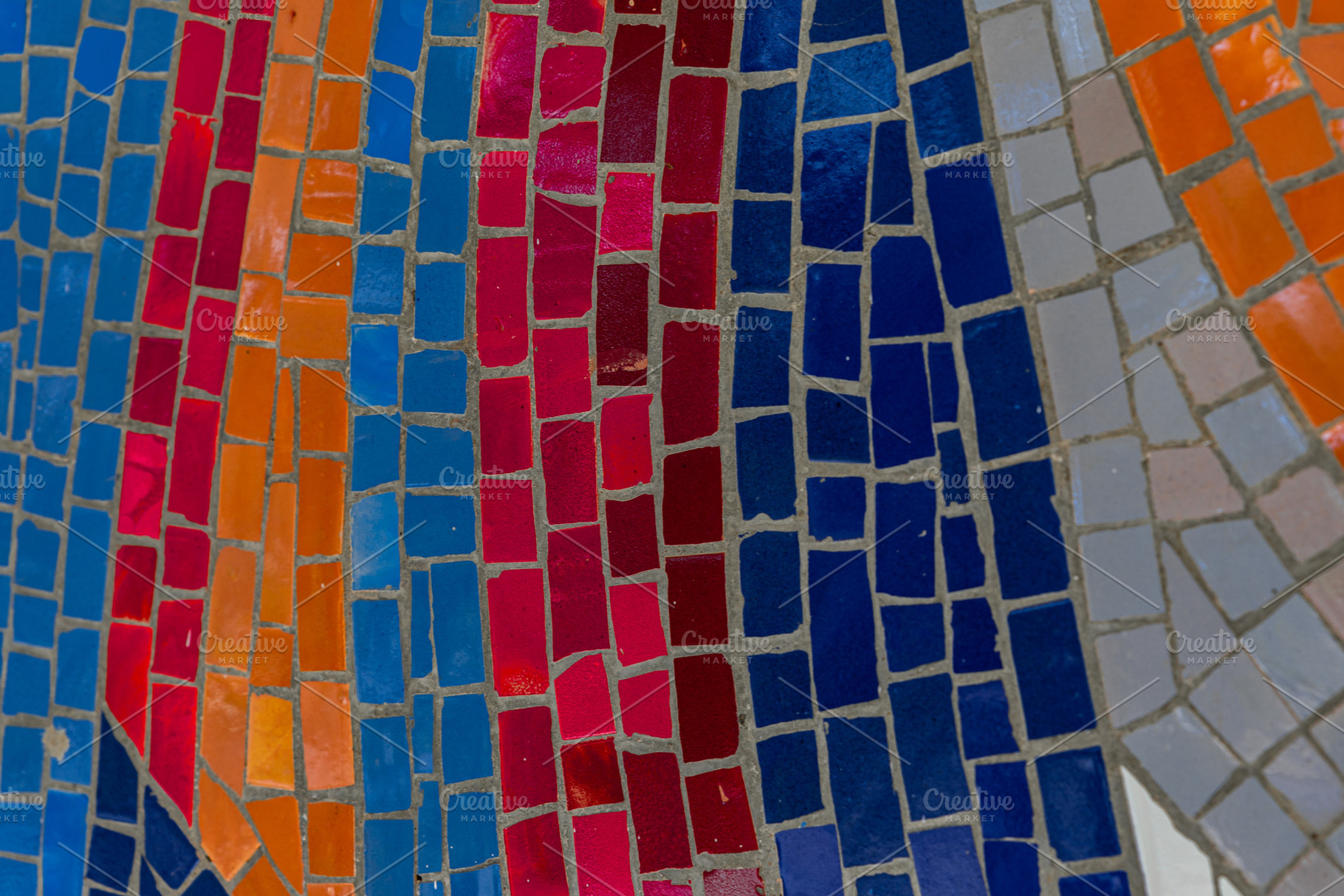 Close-up view of vibrant mosaic tiles in red, orange, blue, and, a Background Photo by Ales Munt