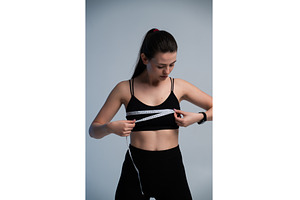 Woman measuring chest with tape, a Sports & Recreation Photo by volodymyrshtun13795