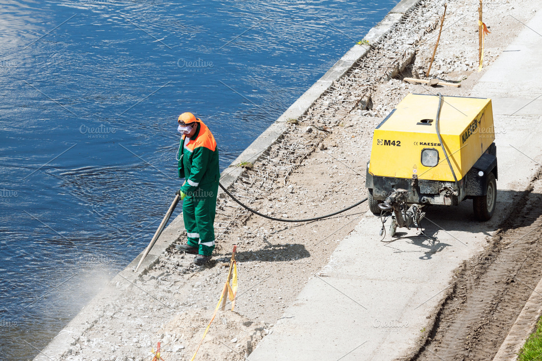 Construction worker at work, a Person Photo by BOOCYS