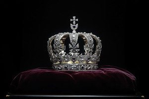 Crown displayed on velvet cushion, a Photo by Beautiful things