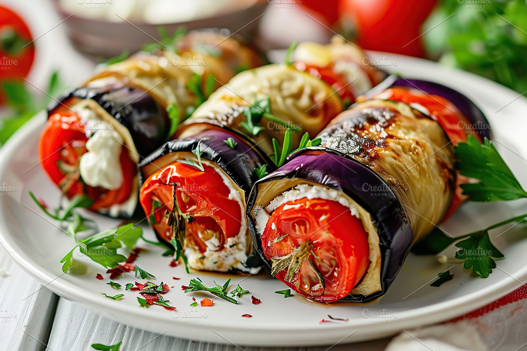 Rolled up eggplant stuffed with cheese and tomatoes in plate, a Food & Drink Photo by AlyaAnd