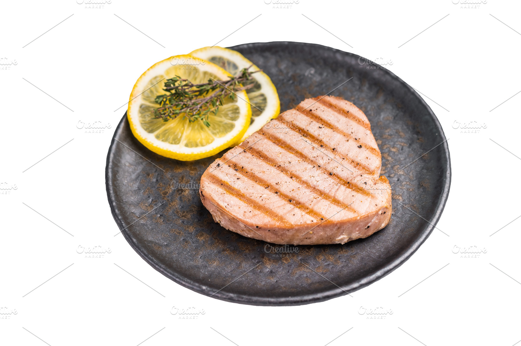 Deliciously charred grilled tuna steak, served with fresh herbs,, a Food & Drink Photo by composter-box@mail.ru