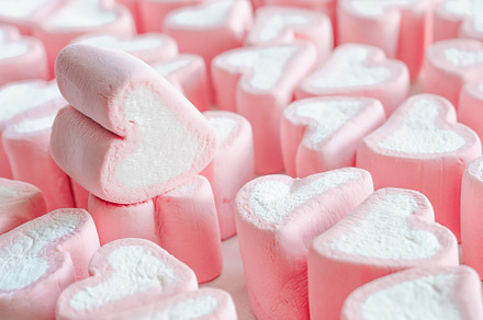 Pink marshmallow close up background featuring rose, pink, and heart