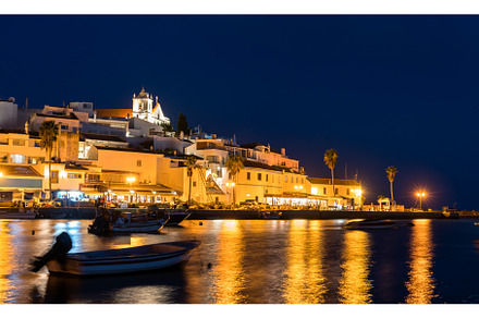 Ferragudo village with fishing boats, an Architecture Photo by Leonid Andronov