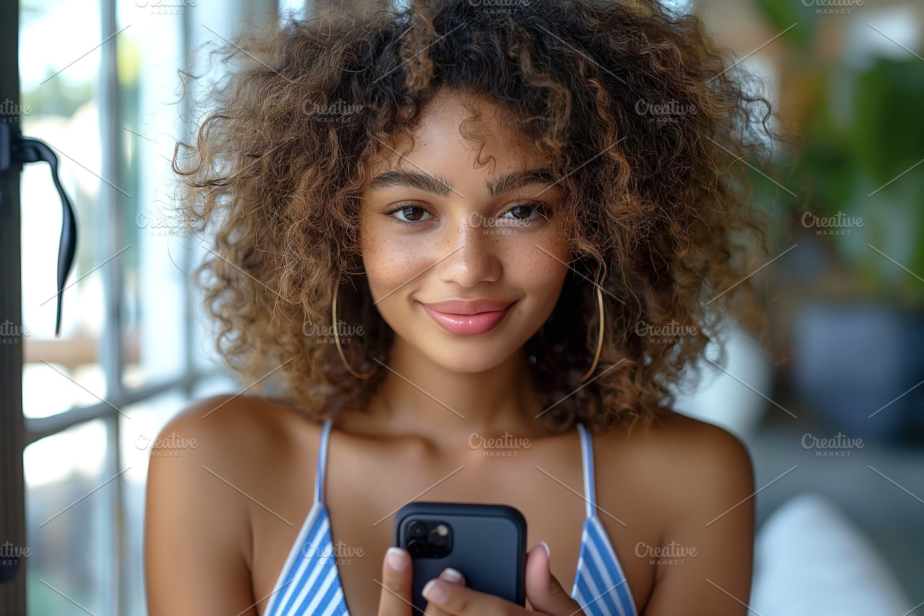 A young woman of mixed ethnicity with curly hair smiles while us, a Person Photo by ImageMir