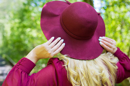 beautiful girl in cherry dress with a hat in the woods., a Person Photo by Artsaba Family