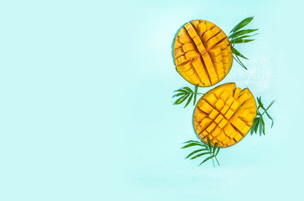 Fresh whole and sliced mango, a Food & Drink Photo by Rimma