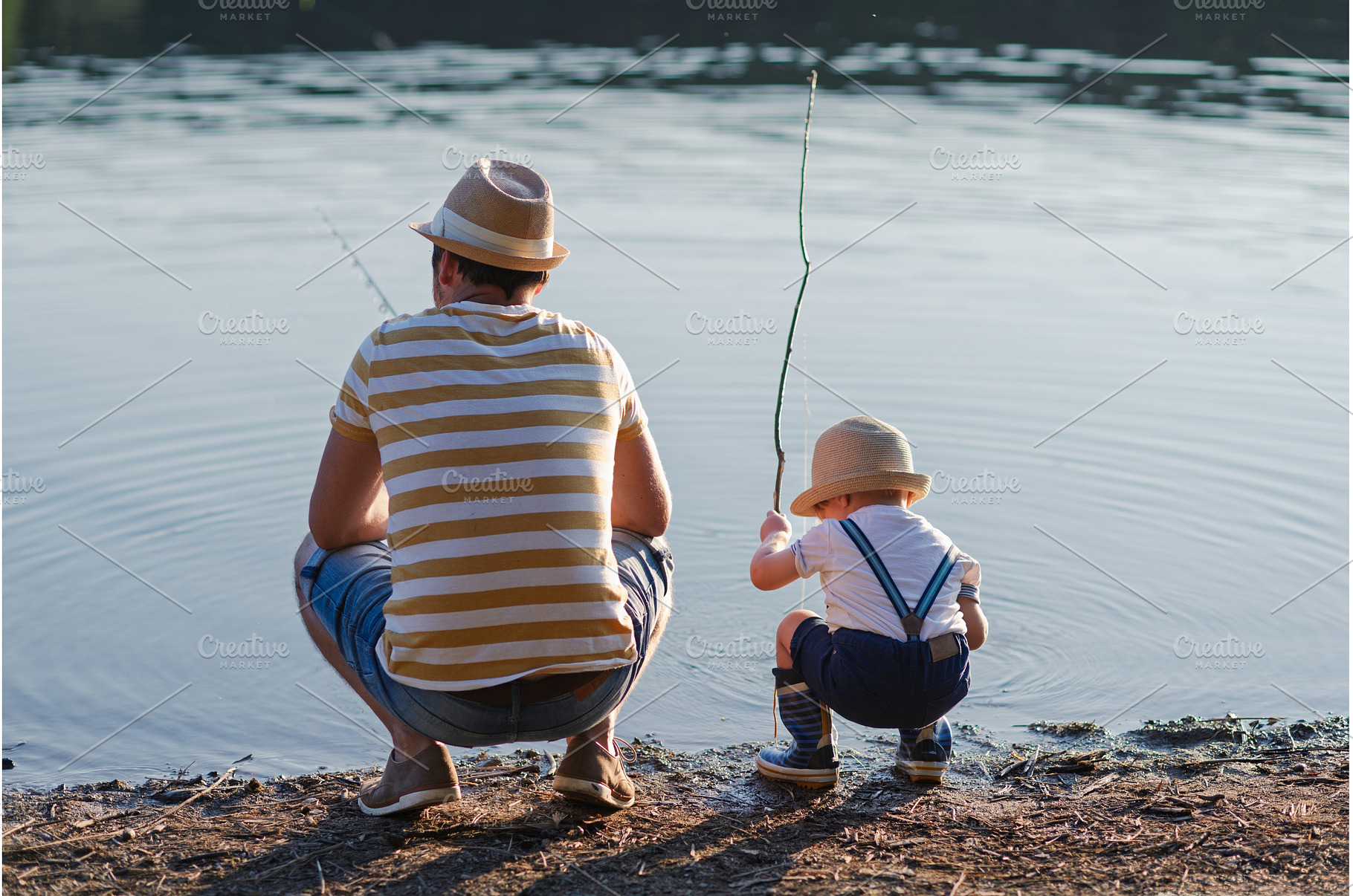 Dad teaching his little boy how to, a Person Photo by HalfPoint