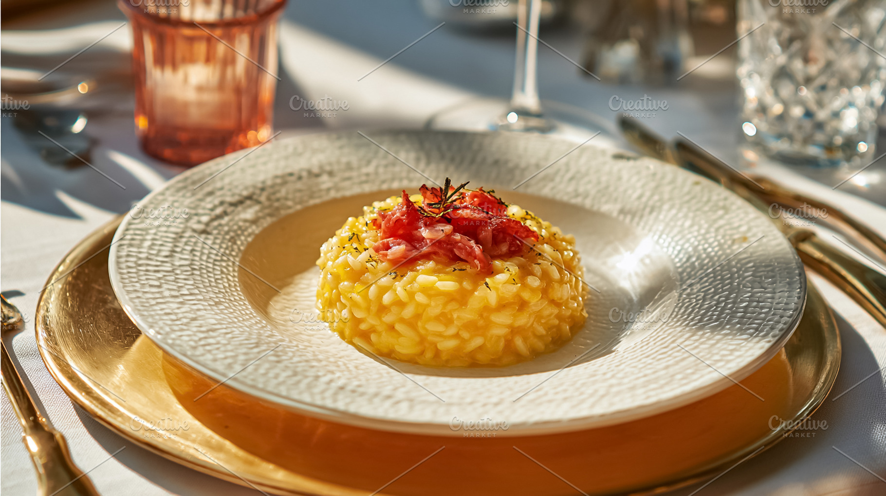 Gourmet saffron risotto plating with finely chopped prosciutto,, a Photo by Studio ANNA