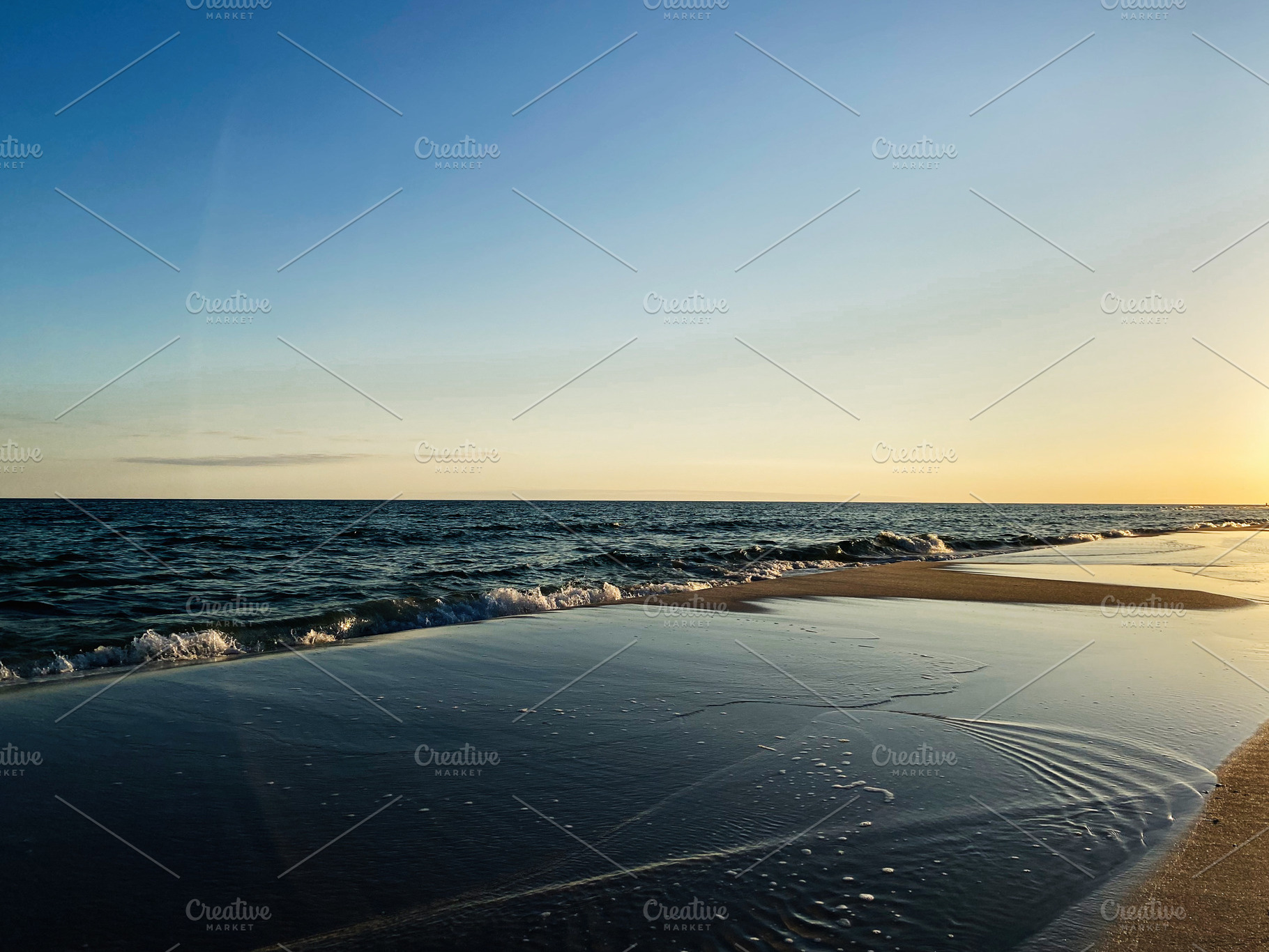 Sunset at a calm Florida Pensacola beach with gentle waves and reflective wet s, a Nature Photo by AS photostudio