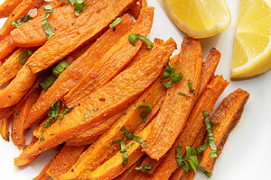 Sweet potato fries with fresh basil and lemon, a Food & Drink Photo by Olena Rudo