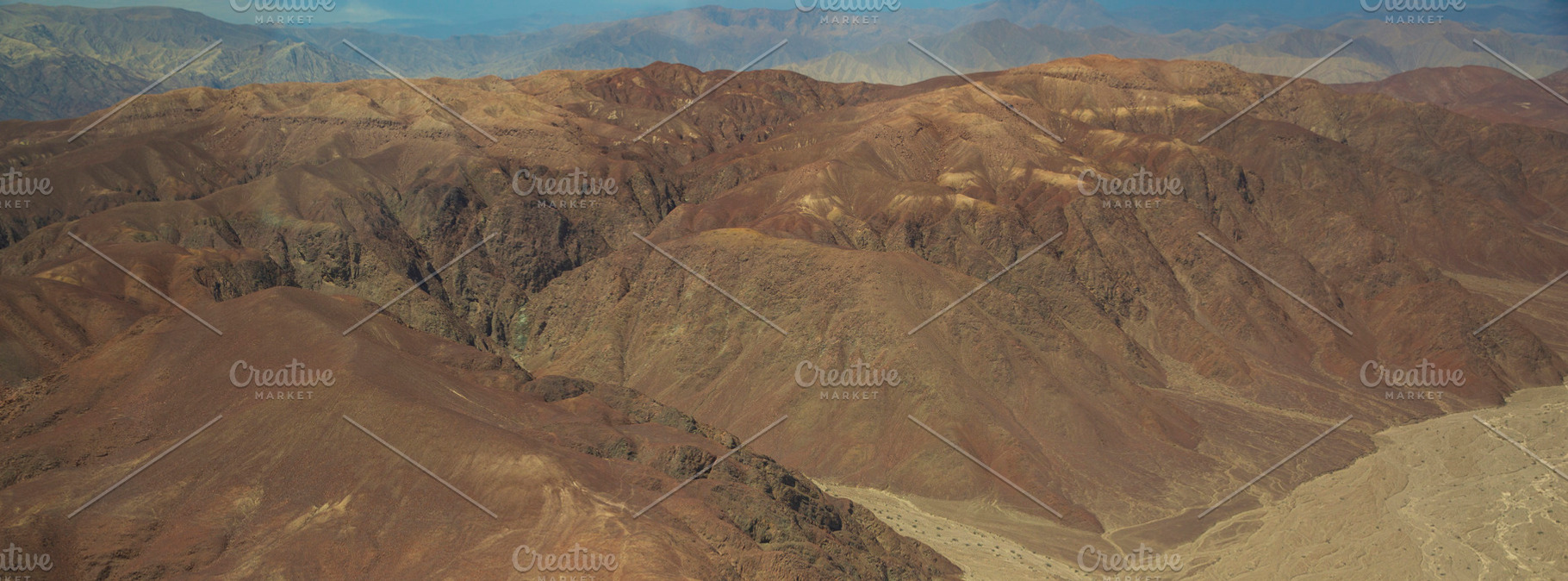 Aerial view of desert canyons and Andes mountain range, terracot, a Photo by Pictures for you!!!!!!!!!