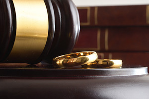 Wooden Gavel and Wedding Rings on Legal Bench, an Abstract Photo by Davizro's Market