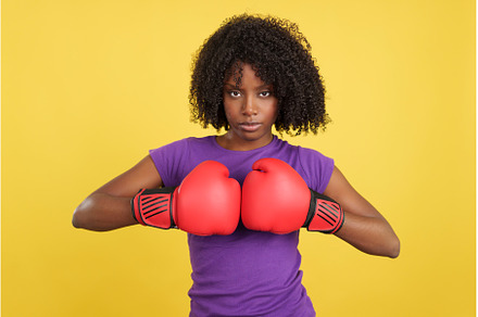 African woman clapping red boxing, a Person Photo by Iván Moreno STOCK PHOTO