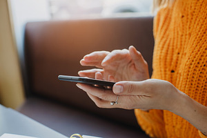 Female hands using phone