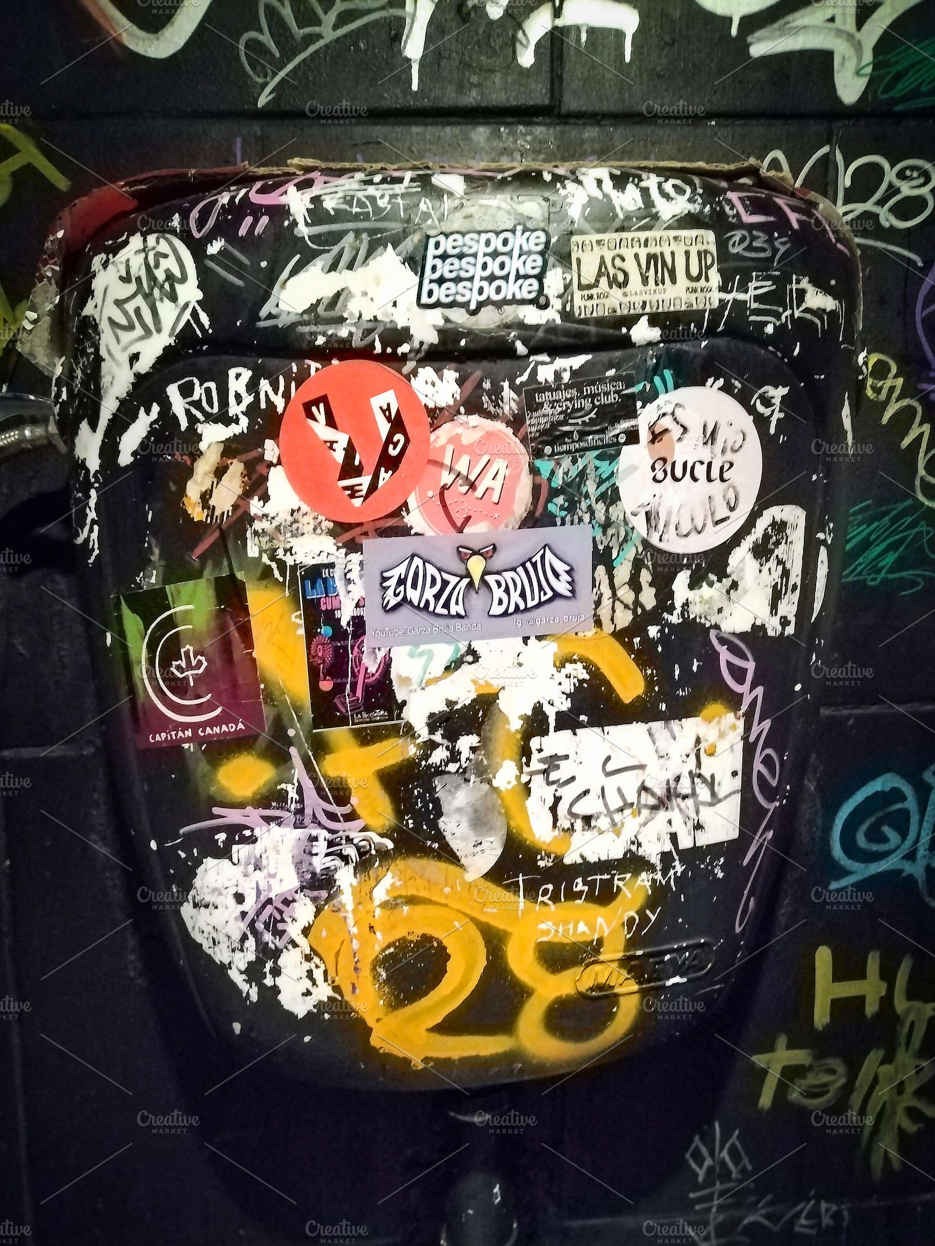 Toilet cistern full of stickers ar bar bathroom, an Arts & Entertainment Photo by DanFLCreativo