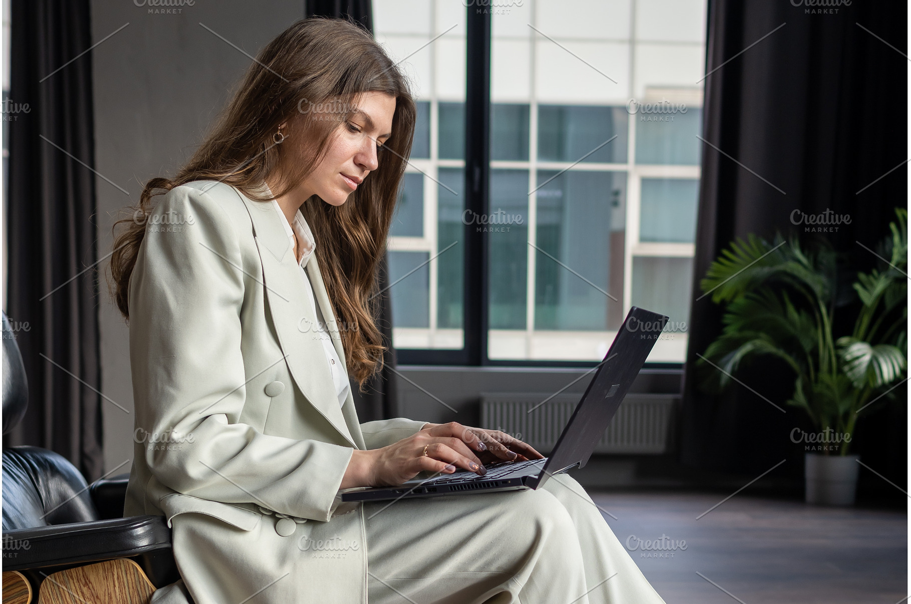Laptop on knees of businesswomen, a Person Photo by undrey