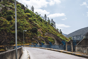 Dam top road with street lighting, an Industrial Photo by SkyNext