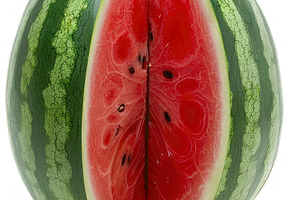 A vertically sliced watermelon with, a Photo by LOGOCREATIVE