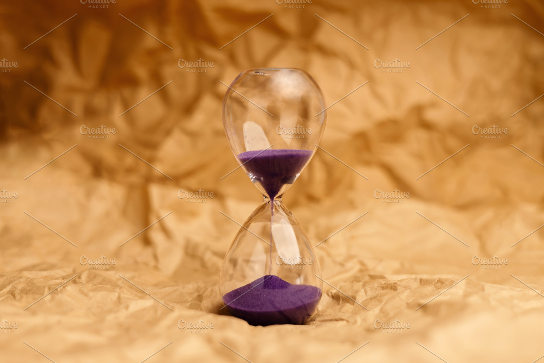 Hourglass with senior age blocks on crumpled pape,aging society,, a Photo by salmon.black