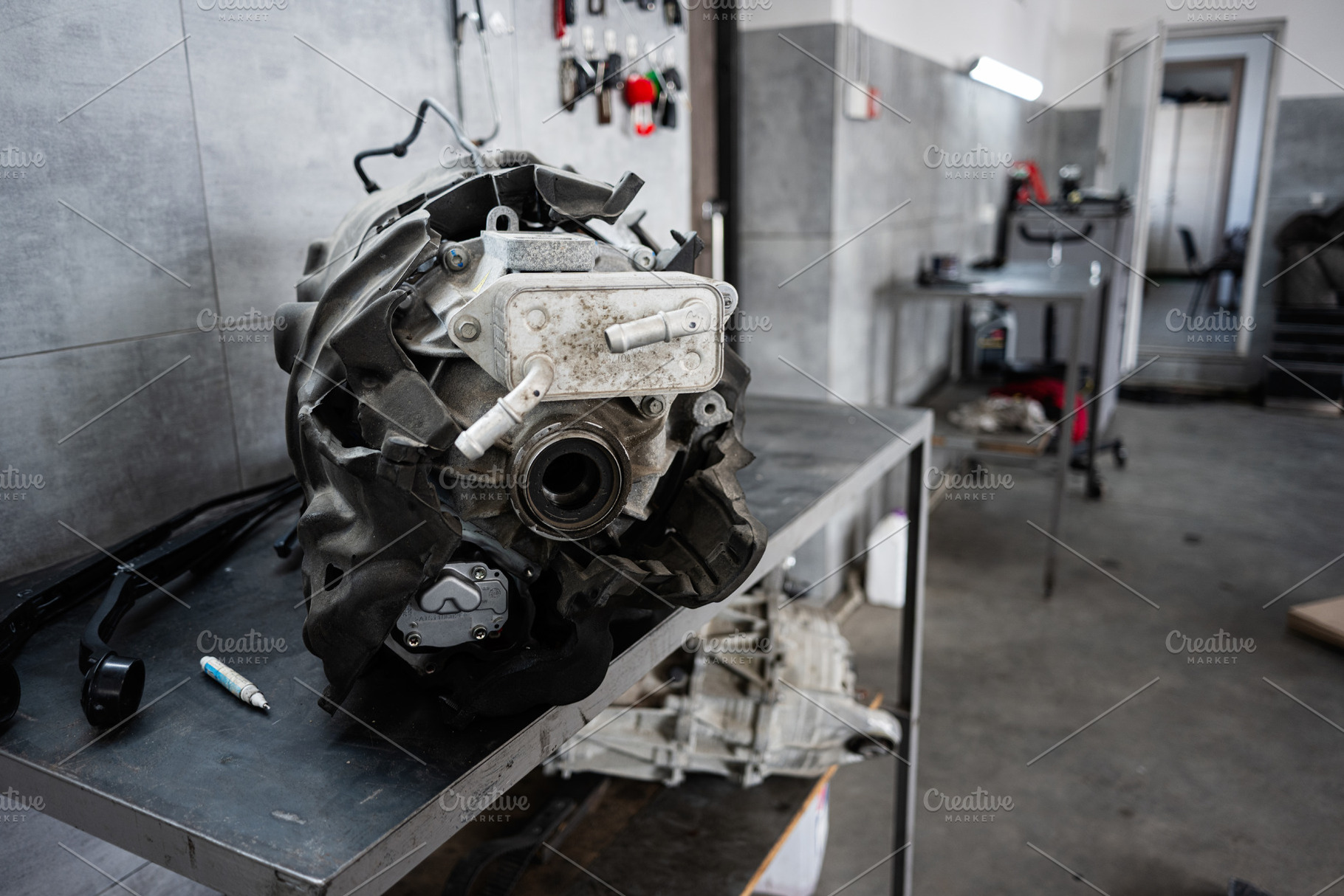 Close-up view of a car engine assembly in a repair workshop, a Transportation Photo by AS photostudio
