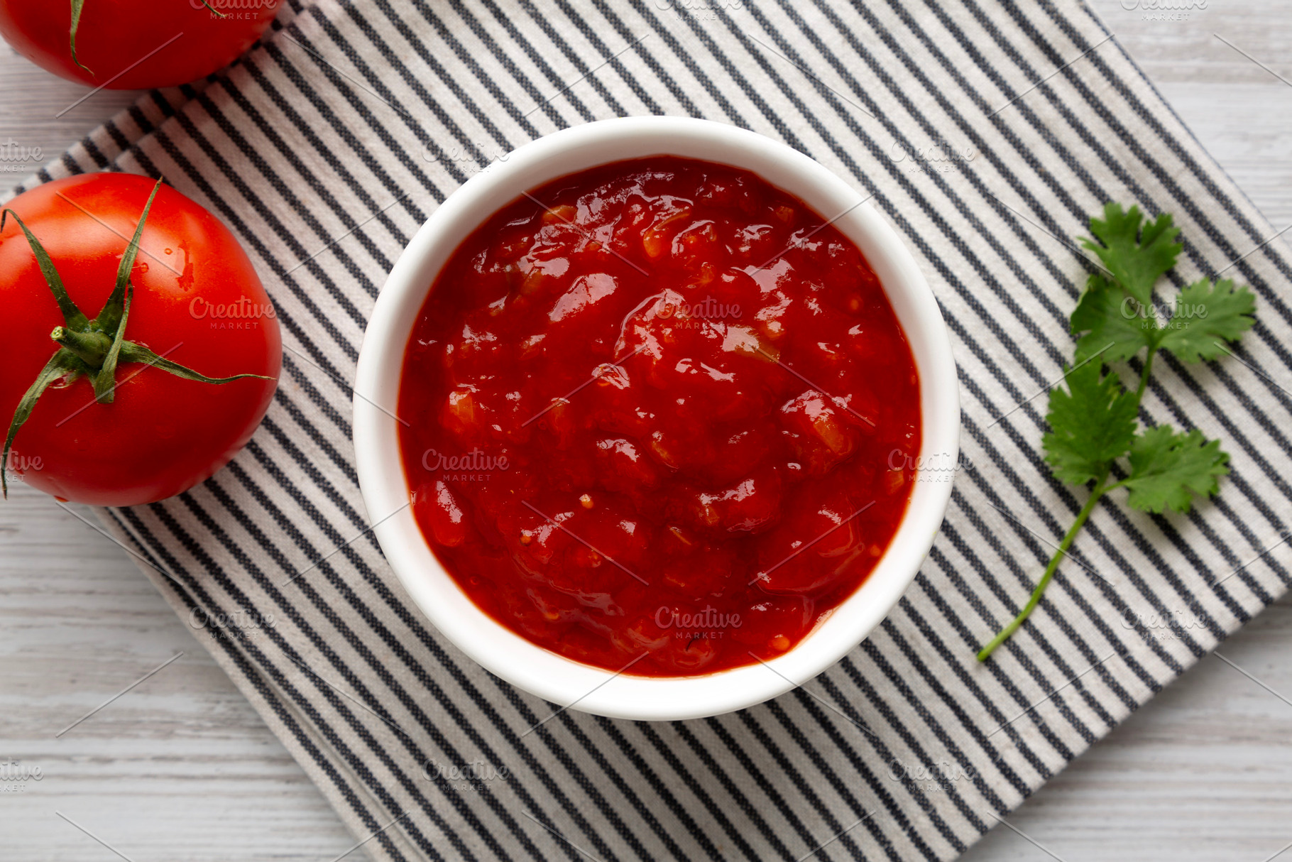 Organic Tomato and Cilantro Salsa in a Bowl, top view., a Food & Drink Photo by LiudmylaChuhunova
