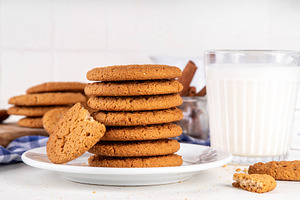 Homemade classic Gingersnap Cookies stack on kitchen table, a Photo by Rimma