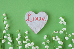 Wooden heart with text Love, a Photo by tilialucida