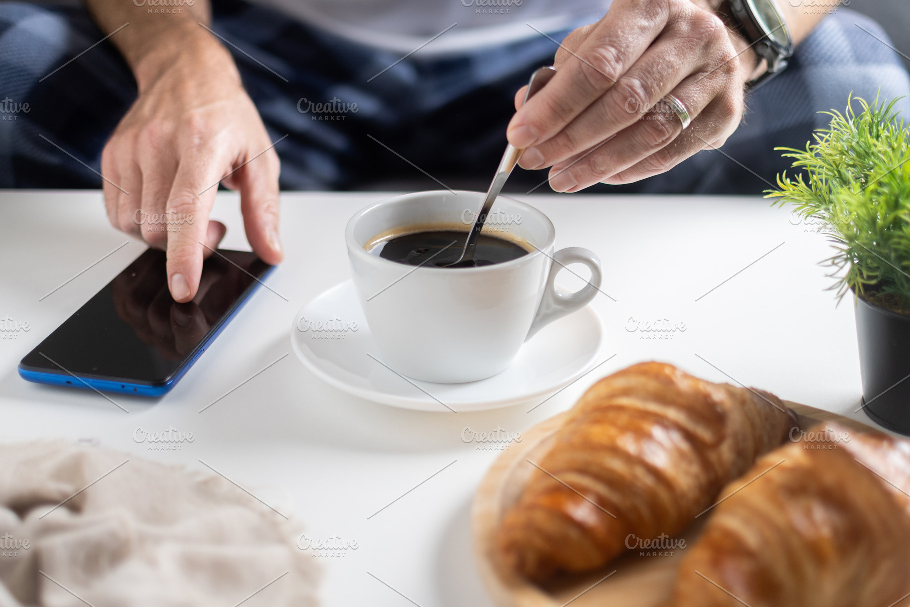 Using Smartphone During Breakfast with Coffee and Croissants, a Food & Drink Photo by etorres69