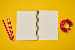 An open spiral-bound notebook with blank pages, surrounded by re, a School & Education Photo by ndanko