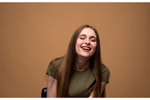 Young woman bursting with laughter, a Person Photo by volodymyrshtun13795