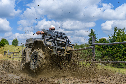 ATV racing on dirt track at summer mountain, a Transportation Photo by Byrdyak
