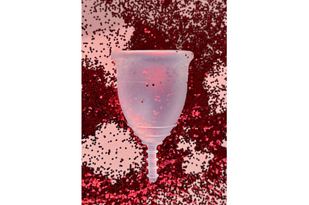 Close-up shot of a menstrual cup on, a Health & Medical Photo by tilialucida