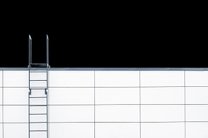 Metal emergency stairs on white wall, an Architecture Photo by BOOCYS