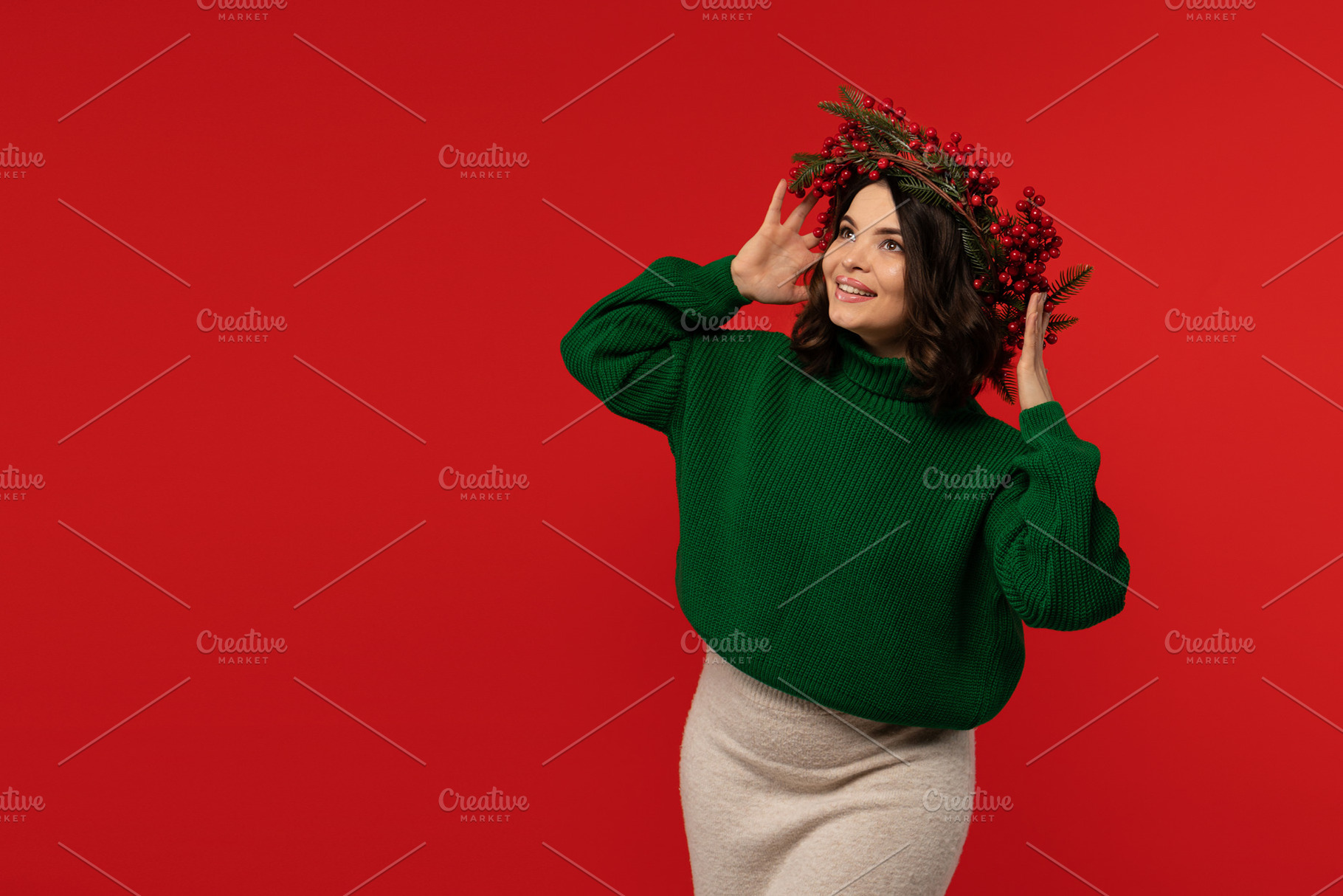 Woman in Christmas wreath looking up, a Holiday Photo by Elena Vagengeim