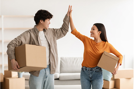 Young Asian couple with cardboard, a Person Photo by Prostock-Studio