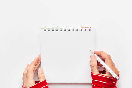 Woman in red sweater, notepad