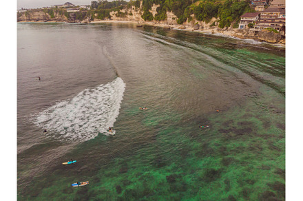 Surfers on the waves in the ocean, a Nature Photo by Elizaveta Galitskaya