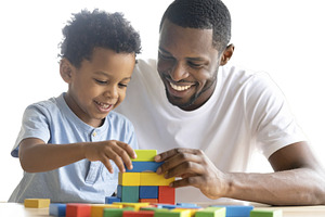 Child and father building with blocks isolated photo, a School & Education Photo by DanFLCreativo