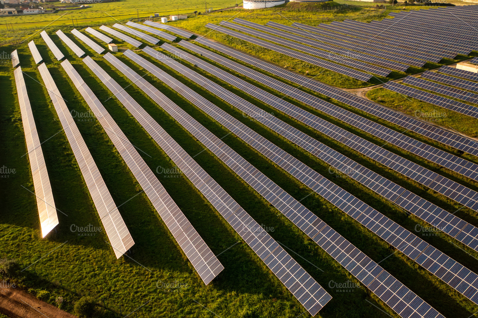 From above view of solar panels on agricultural land during sunny day, a Photo by andreonegin market