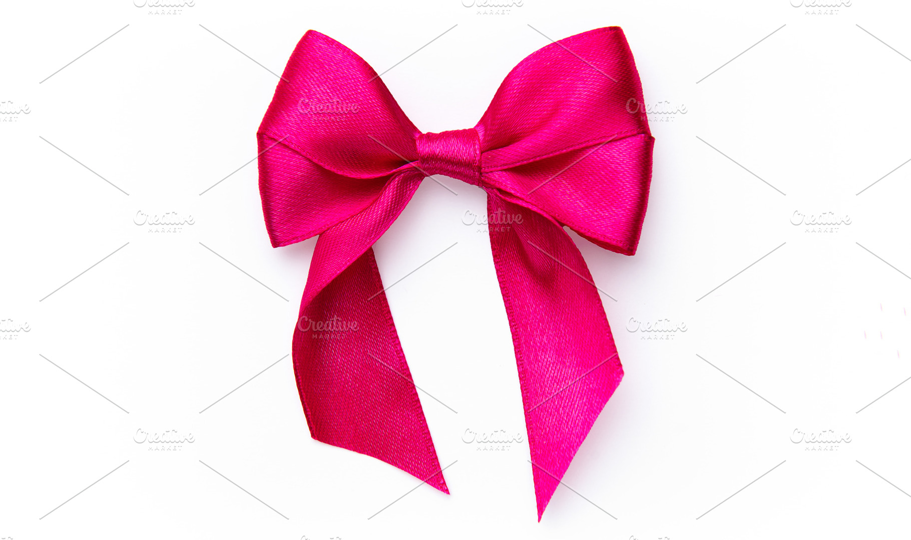Pink satin ribbon creating a decorative bow, a Holiday Photo by Olena Rudo