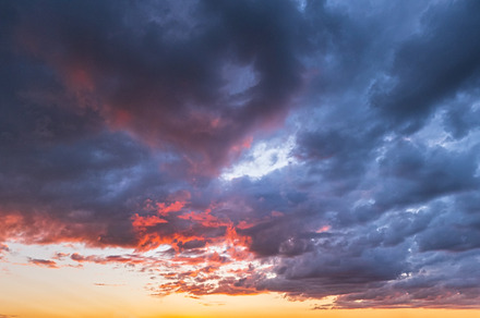 Clouds in evening dusk sky panoramic view. Climate, environment, a Nature Photo by YuriyB