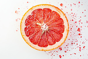 Vibrant grapefruit slice on white, a Photo by Pavel_design