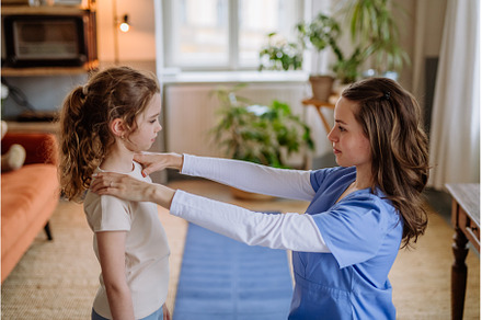 Little girl doing exercise with a, a Health & Medical Photo by HalfPoint