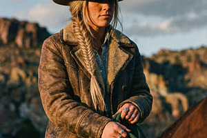 Cowgirl on Horseback with Tan Hat, a Person Photo by Virgo Studio