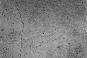 Concrete wall texture with cracks containing abstract, aged, and ancient