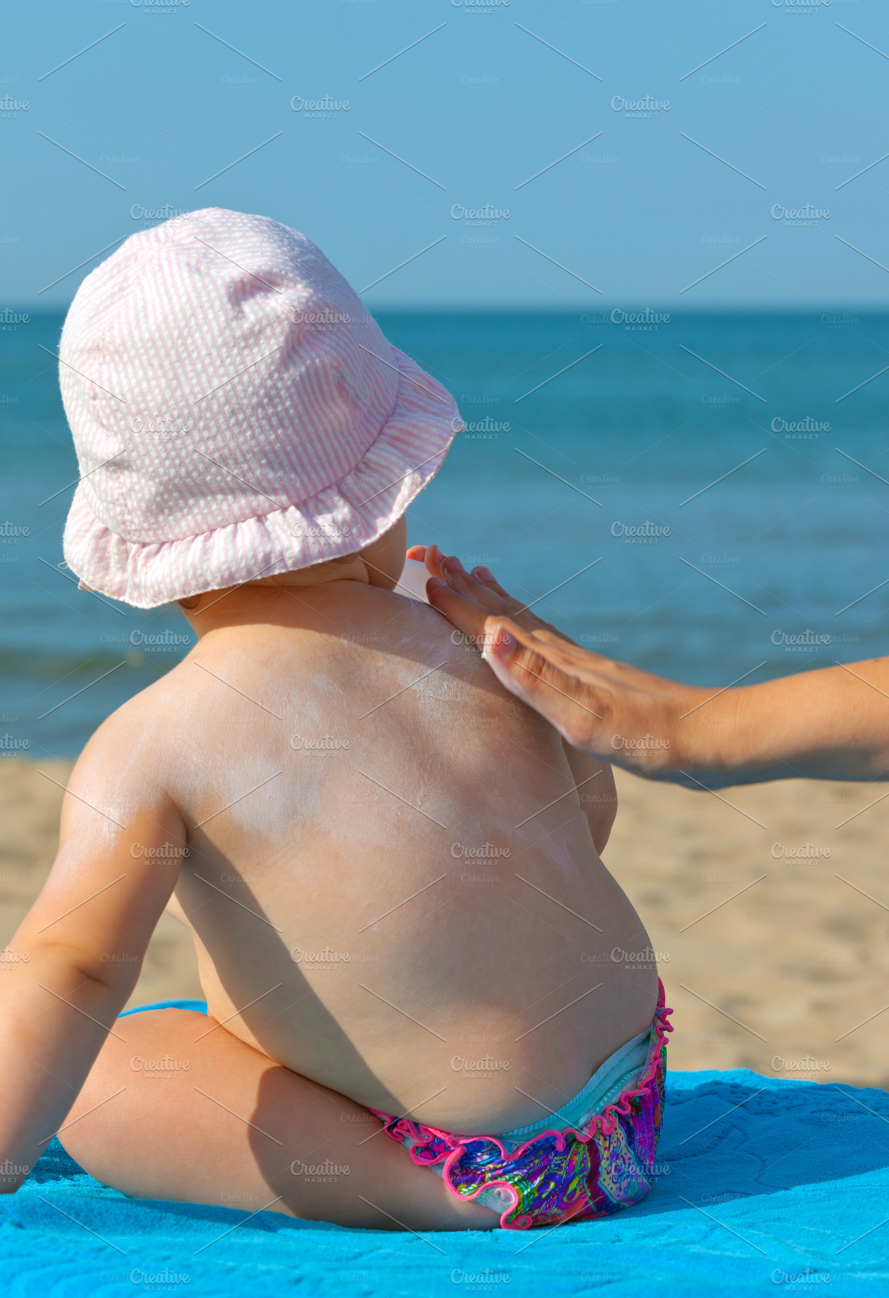 Baby sunscreen cream., a Person Photo by Antonio Gravante Market