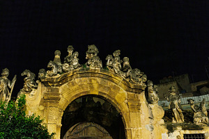 Night view of people and monster sculptures made of tuff in the, an Architecture Photo by Bepslabor